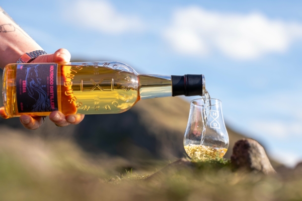 Single Malt Scotch Whisky being poured into a whisky glass.